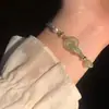 Nova Pulseira Ping An Buckle de Estilo Design de Nicho para Meninas Anel de Elo Casal Pérola Corda de Mão Tecida Presente para Namorada Tendência