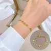 [Acero de titanio para todo el cuerpo] Estilo minimalista de personalidad Dongdaemun pulsera de cadena de cara sonriente personalidad femenina Red social retro Amigas