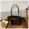 Bolsa Tote Grande para o Dia a Dia Feminina 2026 Nova Couro Encerado Simples Bolsa de Ombro Toque de Luxo Bolsa de Axila