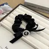 Anillo para el pelo de perla con lazo estilo coreano anillo de intestino grueso con pedrería temperamento simple cuerda para coleta cabeza de bola banda de goma venta al por mayor