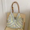 Bolsa de palha tecida nova 2026 transfronteiriça, moderna e da moda, bolsa de ombro estilosa, bolsa de antebraço, bolsa de palha de mão, bolsa de praia para férias