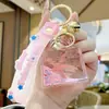 Llavero Botella de Arena Fijadora de Aceite de Estrella de Mar Colgante Exquisito para Mujer Llavero Flotante Lindo para Colgar en Mochila Escolar de Estudiante Niño