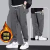 Pantalones térmicos con forro polar transfronterizos, nuevo estilo otoño/invierno, nuevos pantalones deportivos, pantalones de chándal casual para niños, pantalones jogger de corte holgado para hombre