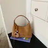 Bolso de media luna minimalista transfronterizo 2026 nueva versión coreana, bolso de axila, bolso de hombro de moda estilo relajado, bolso cruzado casual
