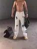 Jeans Rasgado Europeu e Americano Tendência para Homens, Estilo de Rua, Hip-Hop, High Street, Couro com Remendo Cruzado, Calça Longa Branca Retrô