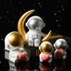 Decoración de astronauta espacial de resina al por mayor, decoración suave de escritorio, estudio, estantería, hogar moderno, regalo de cumpleaños
