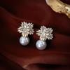 Aretes de perlas de aguja de plata a la moda combinables mariposa nicho lujo ligero de alta gama aretes retro para mujer venta al por mayor de fábrica