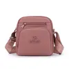 Bolsa de ombro multicamadas em nylon para mulheres, bolsa transversal leve, mochila pequena simples e versátil em tecido Oxford, mochila de mãe