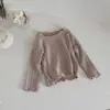 Camiseta base de punto acanalado jacquard de manga larga para bebé estilo INS con bordes sin costuras combinada con un vestido sin mangas