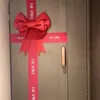 Ramo de cubo de abrazo decorado con lazo rosa, materiales DIY para decoración de dormitorio y sala de bodas, decoración de pared de fondo de Navidad