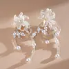 Pendientes de borla de flor de concha blanca transfronterizos europeos y americanos con perlas, pendientes de estilo de corte francés, pendientes ligeros y lujosos con un toque de alta gama