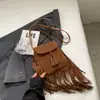 Bolso cruzado de moda con borlas para mujer, versátil, simple, mate, bolso de hombro, bolso cubo retro casual, comercio transfronterizo