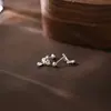 Mini compacto versión coreana S999 puro temperamento fresco pequeño corona de gota de agua clavo de hueso de la oreja 2025 nuevo tornillo