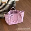 Bolsa de lona con estampado de letras para mujer, nuevo modelo 2026, gran capacidad, bolso de hombro simple y artístico, bolsa para el trabajo