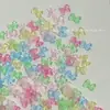 Acessórios para Unhas Laço Cor de Geleia Transparente Gelo Vermelho Líquido Acessórios de Arte de Unha Laço Cor de Geleia Transparente Estilo Fada 3D Borboletas Coloridas Decorações de Unha Venda por Atacado