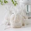 Nueva bolsa de gasa de encaje blanco con flores de cinco pétalos transfronterizas, bolsa de joyería con fondo doblado, bolsa con cordón, regalo creativo, paquete de bambú con bolsillo