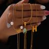 Colgante de piedra de cristal con forma de gota de agua, estilo retro francés, con diseño de amor, estilo festivo, de acero de titanio y chapado en oro.