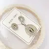 Nuevo especial transfronterizo explosión de tendencia europea y americana titanio acero alta calidad color collar pendientes traje femenino joyería de concha real