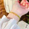 Joyería de oro Jin Yan con oro de arena vietnamita Xizang Buda de cuatro caras patrón martillado pulsera tejida cuerda tejida a mano diy