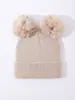 Gorro de lana tejido para niños de color liso transfronterizo con doble pompón para niños y niñas, bebé, lindo, cálido, protección para orejas, gorro de invierno, venta al por mayor