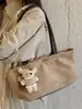 Bolso tote minimalista de nicho estilo coreano 2026 nuevo modelo bolsa de gran capacidad para debajo del brazo bolso de hombro de color liso retro de nicho para commuting