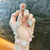 Cadena de llavero de cuentas de colores con luz UV creativa para teléfono móvil, colgante lindo para bolso, accesorios para funda de teléfono móvil, venta al por mayor