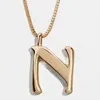 Europa y Estados Unidos gran INS metal viento 26 capital letra inglesa colgante collar largo para hombres y mujeres