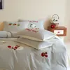 Nuevo juego de otoño e invierno engrosado, 100% algodón de fibra larga, tejido de rizo cepillado, juego bordado de tres o cuatro piezas, juego de ropa de cama para padres e hijos con temática de dibujos animados, 100% algodón