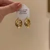 Pendientes de aro elegantes de plata esterlina para mujer 2024 Nuevo sentido de alta gama Otoño e Invierno Dorado Aro grande liso Pendientes de aro redondos