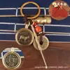 Llavero Zodiacal de Latón Cadena Decorativa Giratoria Juego de Cuatro Piezas con Cuerda de Nube Auspiciosa Vintage de Cinabrio y Monedas de los Cinco Emperadores para la Buena Fortuna