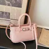 Bolso de mano con patrón de lichi para mujer, nuevo modelo de moda de verano 2026, bolso de hombro y bandolera de alta gama, nicho, lujo ligero, para el día a día
