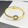 Pulsera europea y americana simple de acero de titanio chapado en oro de 18 quilates con micro incrustaciones de circón colorido de diamante completo, pulsera de moda ins para mujer en stock al por mayor