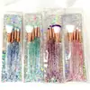 Set de brochas de maquillaje de cuatro piezas con cola de pez, mango de cristal, cerdas suaves, herramientas de belleza brillantes, láser, disponible para venta al por mayor