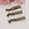 Venta al por mayor de fábrica, suministro transfronterizo, elástico con estampado de leopardo bronceado, scrunchies anudados para el cabello