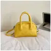Bolso de Mano Minimalista Boston 2026 Modelo Nuevo Bolso de Bowling de Gama Alta Versátil de Nicho Bolso Cuadrado Pequeño Bolso Cruzado