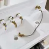Gabinete de baño grifo estilo europeo dorado doble lavabo juego de cuatro piezas extraíble dividido combinación Lavabo grifo de tres-cuatro agujeros