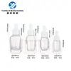 En stock botella cuentagotas de 40 ml en stock botella cuadrada de pared gruesa con fondo de rejilla de 20 ml botella de vidrio transparente de 30 ml botella para aceite esencial