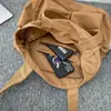 Bolsa de lona vintage Bolsa de ombro portátil de grande capacidade Bolsa de viagem casual masculina e feminina Bolsa tote coreana Ins
