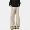 Pantalones de chándal anchos para hombre de color avena con estampado de espiga, cordón, dobladillo curvo, corte holgado y un estilo relajado hasta el suelo