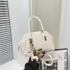 Bolso de mano casual simple de diseño nicho transfronterizo estilo coreano para mujer, nuevo bolso de hombro versátil de moda 2026 para el día a día