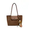 Otoño 2026 Nuevo Bolso de Hombro Individual con Textura Tejida Retro Bolso Tote de Gran Capacidad para Mujer Moda para el Trabajo de Mano Bolso para Madre e Hijo