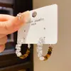 Prata Banho de Ouro Real 18K Agulha de Prata Luxo Acessível Zircônia Pedra Olho de Tigre Brincos Redondos Retrô High-End Nicho Brincos Elegantes