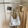 Bolso de mujer de alta gama 2026 nuevo modelo mochila multifuncional de nicho bolso de hombro para el trabajo diario bolso cruzado de gran capacidad