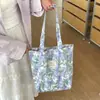 Bolsa de mano de algodón floral estilo coreano, un bolso versátil y elegante que se puede llevar en la mano o colgar al hombro, perfecto para estudiantes mujeres, ligero y con gran capacidad, ideal para llevar libros a clase