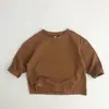 Camiseta versátil nueva de algodón puro para niños de primavera y otoño, elegante camiseta básica de manga larga de color liso para niños y niñas, estilo coreano para bebés y niños pequeños