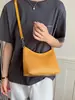 Bolso de axila de textura tejida de nicho estilo coreano transfronterizo para mujer, nuevo popular de verano 2026, bolso versátil de hombro y cruzado tipo bola de masa