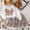 Chicas Europeas y Americanas Primavera y Otoño Nuevo Sudadera con Patrón de Lazo de Mariposa Conjunto de Dos Piezas Falda Corta Esponjosa con Estampado de Leopardo Moda de Temperamento Fabricante