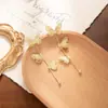 Aretes de Diseño de Alta Gama Aguja de Plata Largos Dorados Estéreo Mariposa Borla Aretes de Lujo Accesible Aretes de Nicho Cobre
