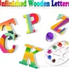 Aproveite os mais vendidos enfeites decorativos de madeira feitos à mão de 10 cm com 26 letras em formato de letras para projetos DIY no atacado.
