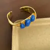 Moda Europea y Americana Pulsera Abierta Lujo Accesible Latón Chapado en Oro de 18K Diseño de Nicho Retro de Gama Alta Pulsera Azul Marrón